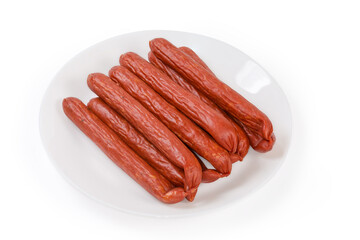 Bunch of kabanos sausages on dish on a white background