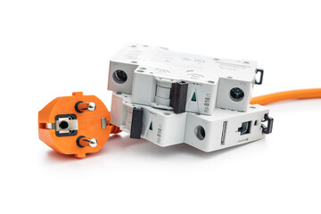 Circuit breaker and orange electric plug isolated on white background.