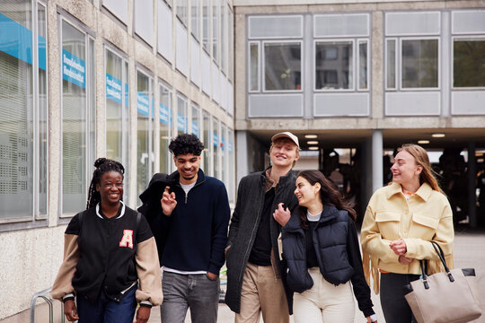 Group of friends walking at campus