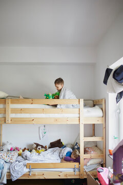 Brothers lying in bunk bed