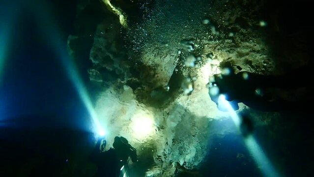 Scuba diving at chandelier cave in Palau. Diving on the reefs of the Palau archipelago.