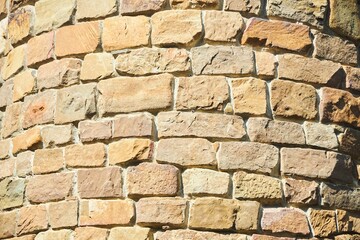 Background texture of a stone wall photo. Natural stone wall texture for the background. Old brick texture, grunge background of a brick wall.