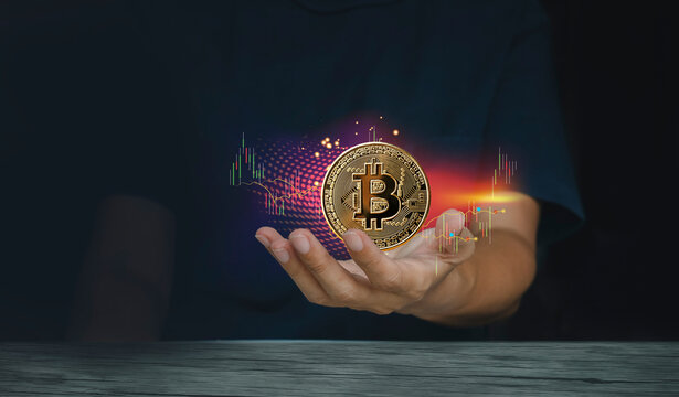 Hand of a casual businessman wondering what the future. Digital cash system and associated currency Bitcoin