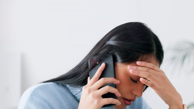Phone, stress and bad news with a woman on call while looking sad or upset and struggling with grief and loss. Depression, mental health and frustration with a young female talking on a mobile device