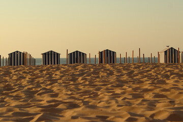 Sandy beach with changing cabins