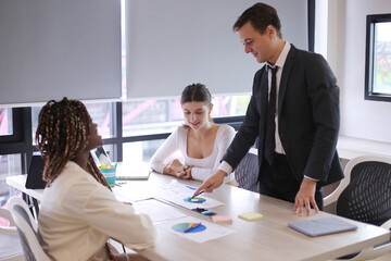 Shot of a group of businesspeople in a meeting at work