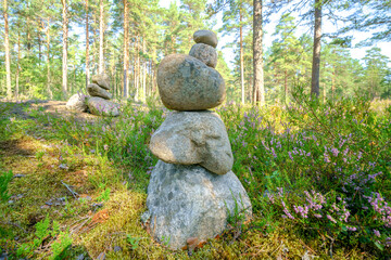 Pyramid of stones. Unstable balance of stone objects. Idyllic state of nature.