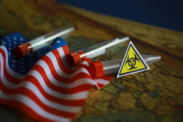 American flag and biohazard sign. The concept of American biolabs and research centers.