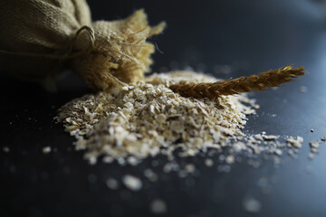World grain crisis. A handful of cereals and on a dark background.