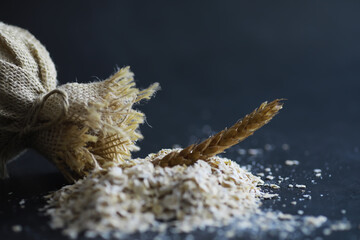 World grain crisis. A handful of cereals and on a dark background.