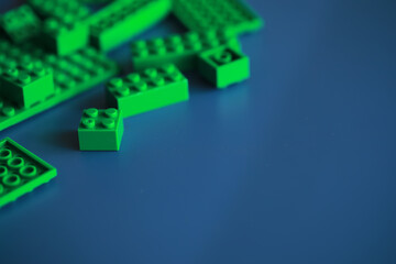 A scattering of constructor elements for children. Colored bricks from the puzzle.