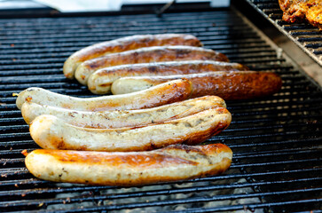Grilled sausages on a cast iron grill