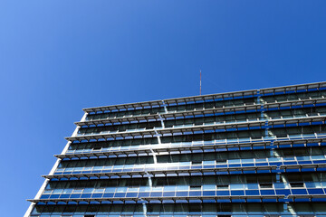Solar panels installed on office building's` glass facade. photovoltaic PV sun collector solar...