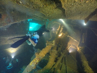 Diving on the ship wrecks of the Palau archipelago. These ship wrecks were from Japanese Navy at...