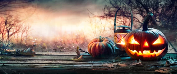 Foto op Plexiglas Halloween Pumpkin On Table In Spooky Landscape © Romolo Tavani