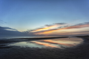 Fototapeta na wymiar Beautiful cloudscape over the sea, sunrise shot