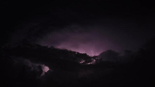 Thunderstorm in the clouds at night time lapse 