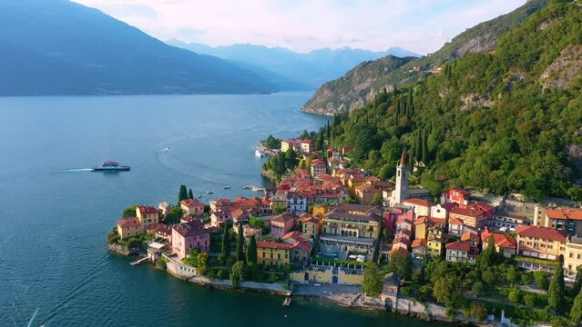 Village of Varenna on Como lake in Italy. Varenna by Lake Como in Italy, aerial view of the old town with the church of San Giorgio in the central square. Famous mountain lake in Italy