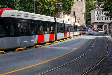 Fototapeta na wymiar modern street with tram and cars travel, horizontal.