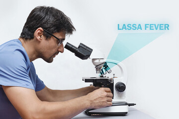 A brunette histologist doctor in a blue medical uniform looks in a professional microscope for a...