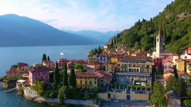 Village of Varenna on Como lake in Italy. Varenna by Lake Como in Italy, aerial view of the old town with the church of San Giorgio in the central square. Famous mountain lake in Italy