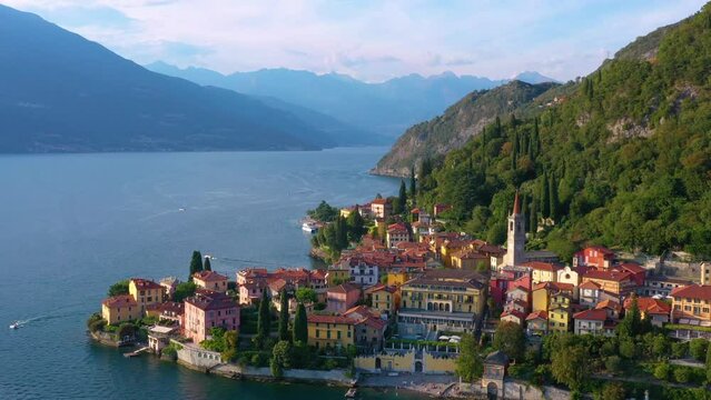 Village of Varenna on Como lake in Italy. Varenna by Lake Como in Italy, aerial view of the old town with the church of San Giorgio in the central square. Famous mountain lake in Italy