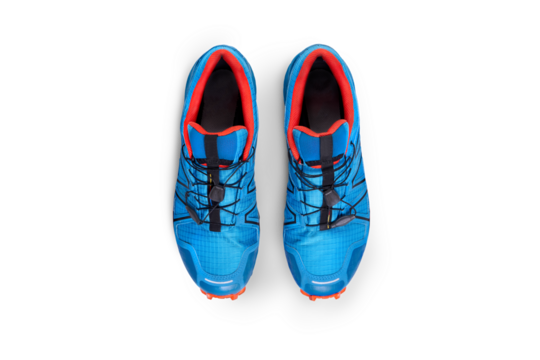 A top view of blue and orange trainers, sneakers Isolated on a flat background.