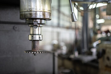 Heavy steel milling head of the lathe machinery. Industrial equipment object, close-up and selective focus.