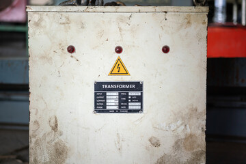 Electricity transformer with high voltage caution safety sign and specification tag on the control...