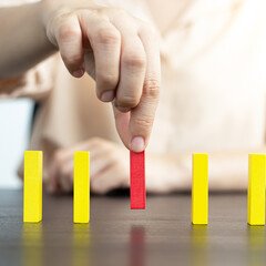 Strategies and risks of wooden games, .Close-up of business people gambling with investment risk,...