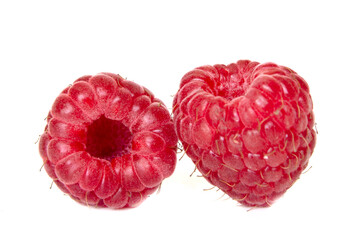 Isolated berries. Two fresh raspberries isolated on white background