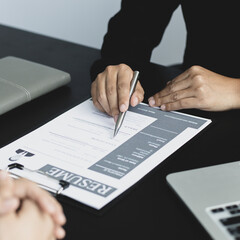 Employer or HR department is reading the resume and interviewing the ability of new employees,...