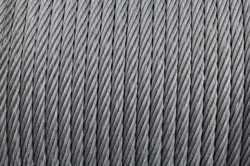 Steel rope is on a winch, close up, abstract industrial background