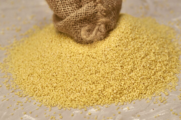croup couscous poured out of a canvas bag on the table