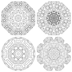 Hand drawn zentangle set of 4 mandalas for coloring page.