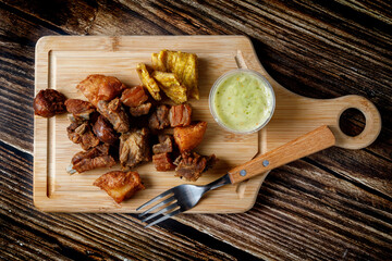 Traditional Colombian food with fried meat and banana