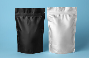 Different blank foil packages on light blue background