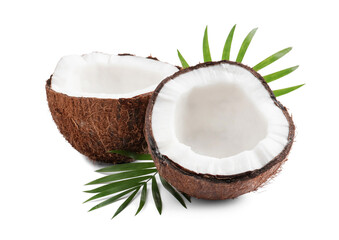 Halves of fresh ripe coconut with green leaves on white background