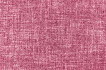 Texture of natural pink upholstery fabric or cloth. Fabric texture of natural cotton or linen textile material. Blue canvas background. Decorative fabric for curtain, furniture, walls, clothes