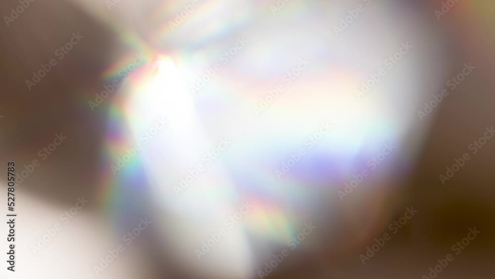 Wall mural rainbow flicker and sunny bokeh. loop. the light passes through the facets of a slowly rotating diam