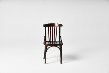 Dark chair on cyclorama under flash light