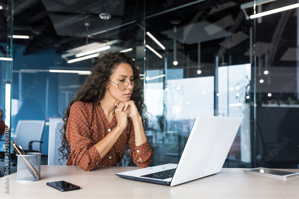 Wall mural pensive and focused female programmer web developer working in modern product development company hi