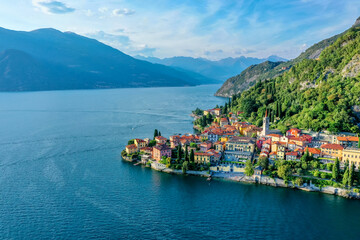Village of Varenna on Como lake in Italy. Varenna by Lake Como in Italy, aerial view of the old town with the church of San Giorgio in the central square. Famous mountain lake in Italy
