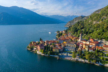 Village of Varenna on Como lake in Italy. Varenna by Lake Como in Italy, aerial view of the old town with the church of San Giorgio in the central square. Famous mountain lake in Italy