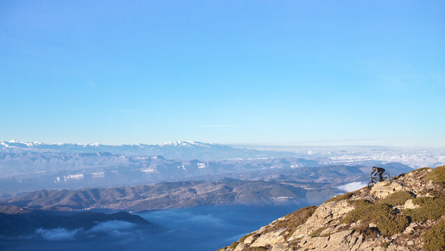 Man riding on bike from top of mountain