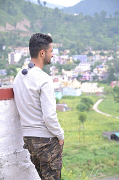 a man standing top of the hill, fun with nature.