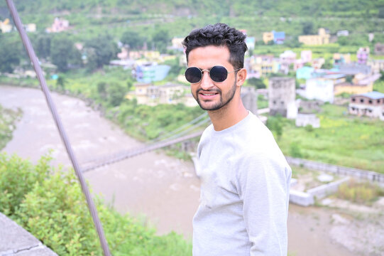 a young man smiley face with blurred background.
