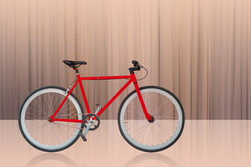Fototapeta na wymiar side view red and black and white bicycle on motion and speed brown background, object, fashion, sport, relex, decor, copy space