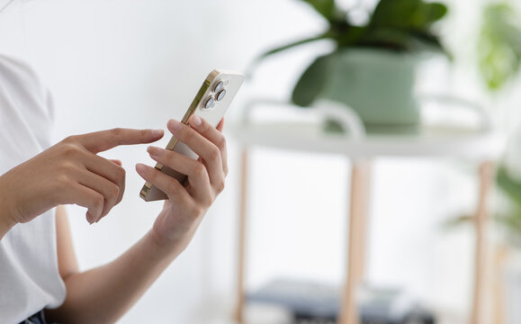 Close Up Woman Hand Using Smart Phone With Hand Finger Touch Screen, Texting, Chatting Or Social Media