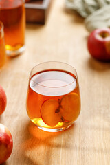 Fresh Homemade Apple juice, cider in a glass and fresh apples on wooden table. Refreshing summer, autumn drink.